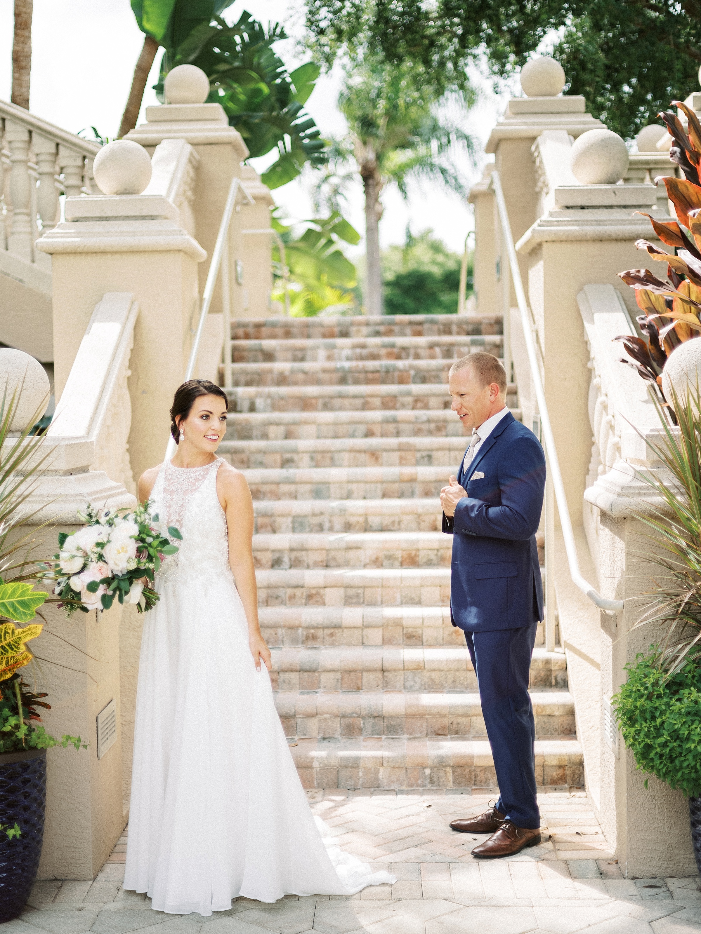 Club at the strand naples wedding, the strand naples wedding, naples wedding photographer, first look photo on stairs 