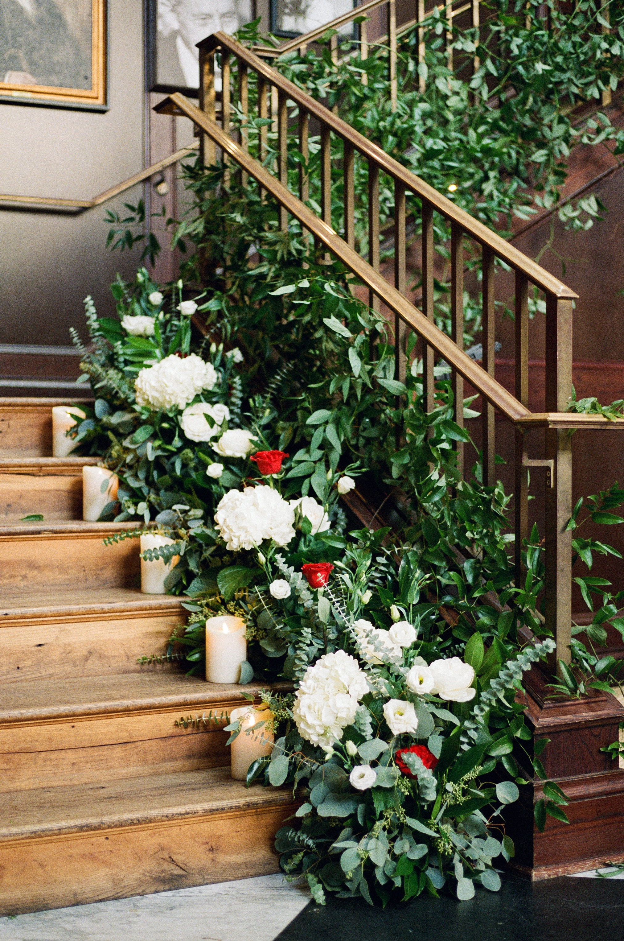 Beautiful florals on staircase at Oxford Exchange Tampa by Botanica