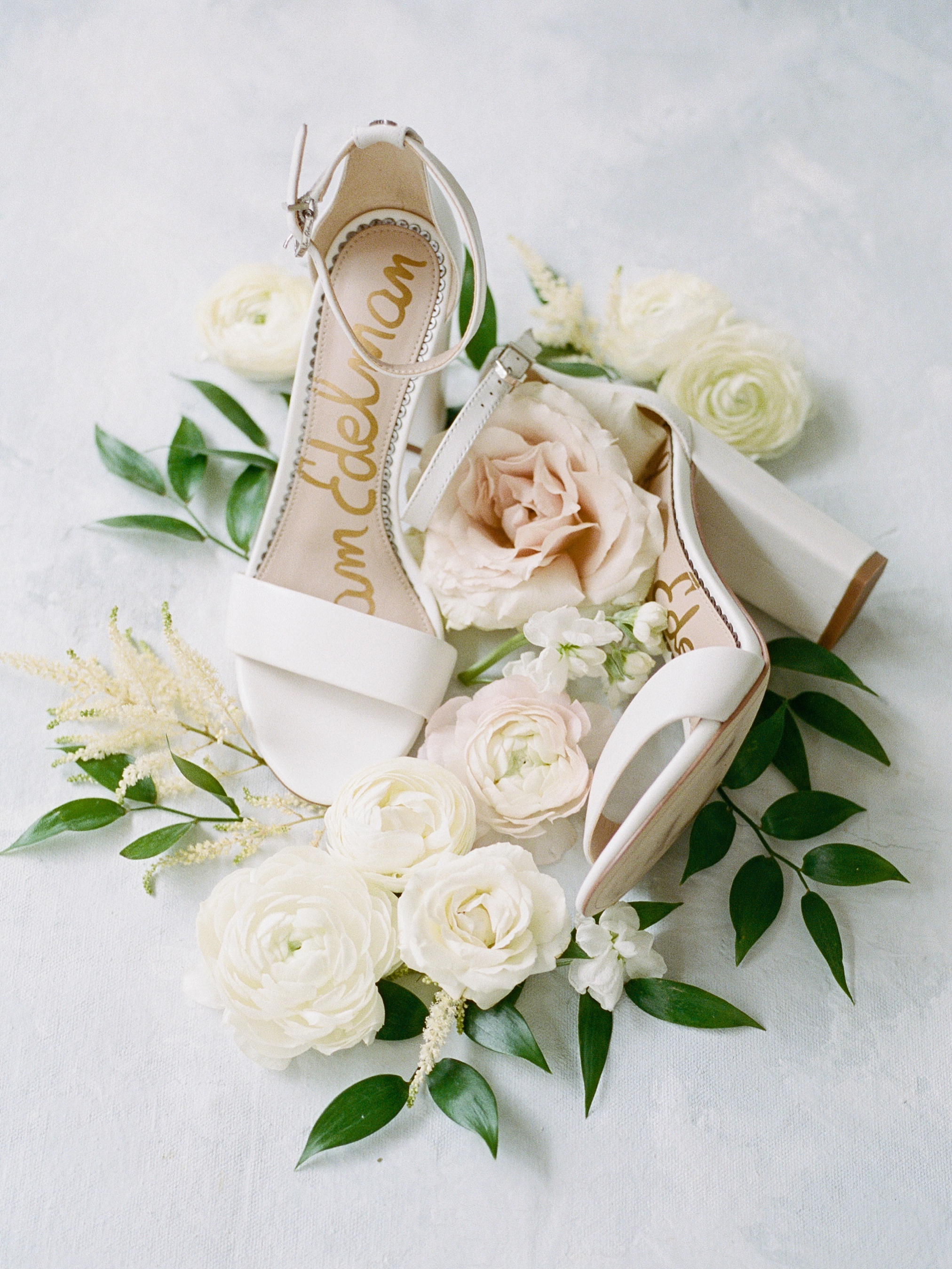 Wedding shoes and florals flat lay photography at Palmetto Riverside Bed and Breakfast 