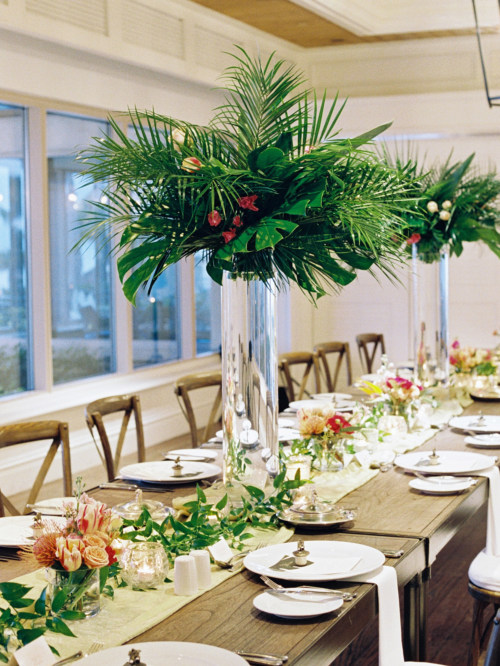 Tall tropical centerpieces at this micro wedding in sarasota Florida 
