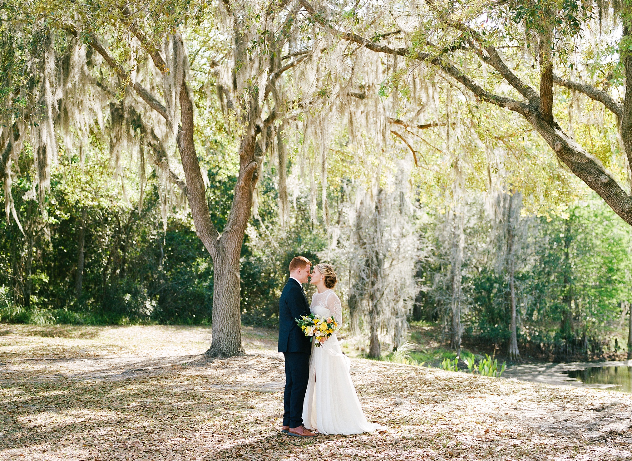 Lakeland Wedding at Haus 820, portrait of bride and groom with beautiful yellow florals 