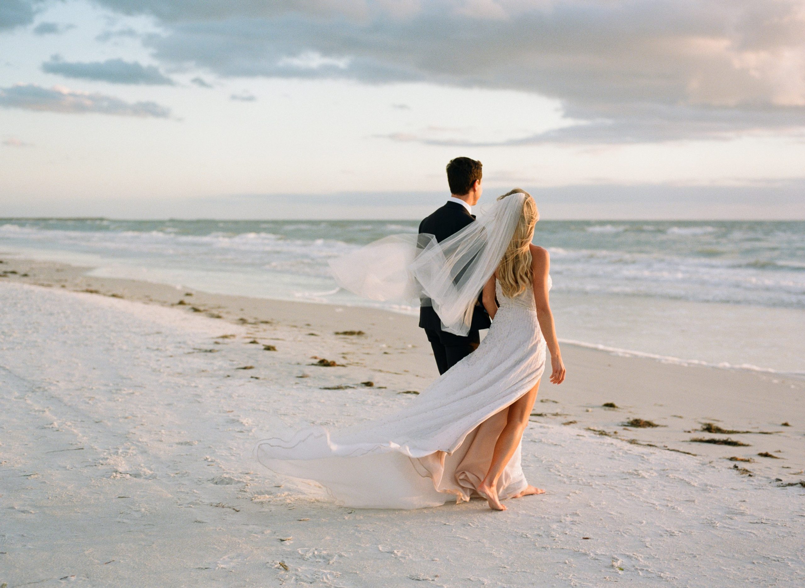 sunset photo of bride and groom at the don cesar hotel 